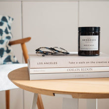 Load image into Gallery viewer, Geodesis nature candle in brown glass with books
