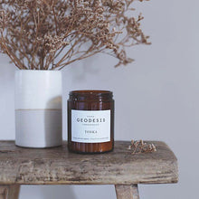 Load image into Gallery viewer, Geodesis nature candle in brown glass with flowers