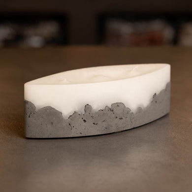 Cement based, elongated ellipse shaped table top candle